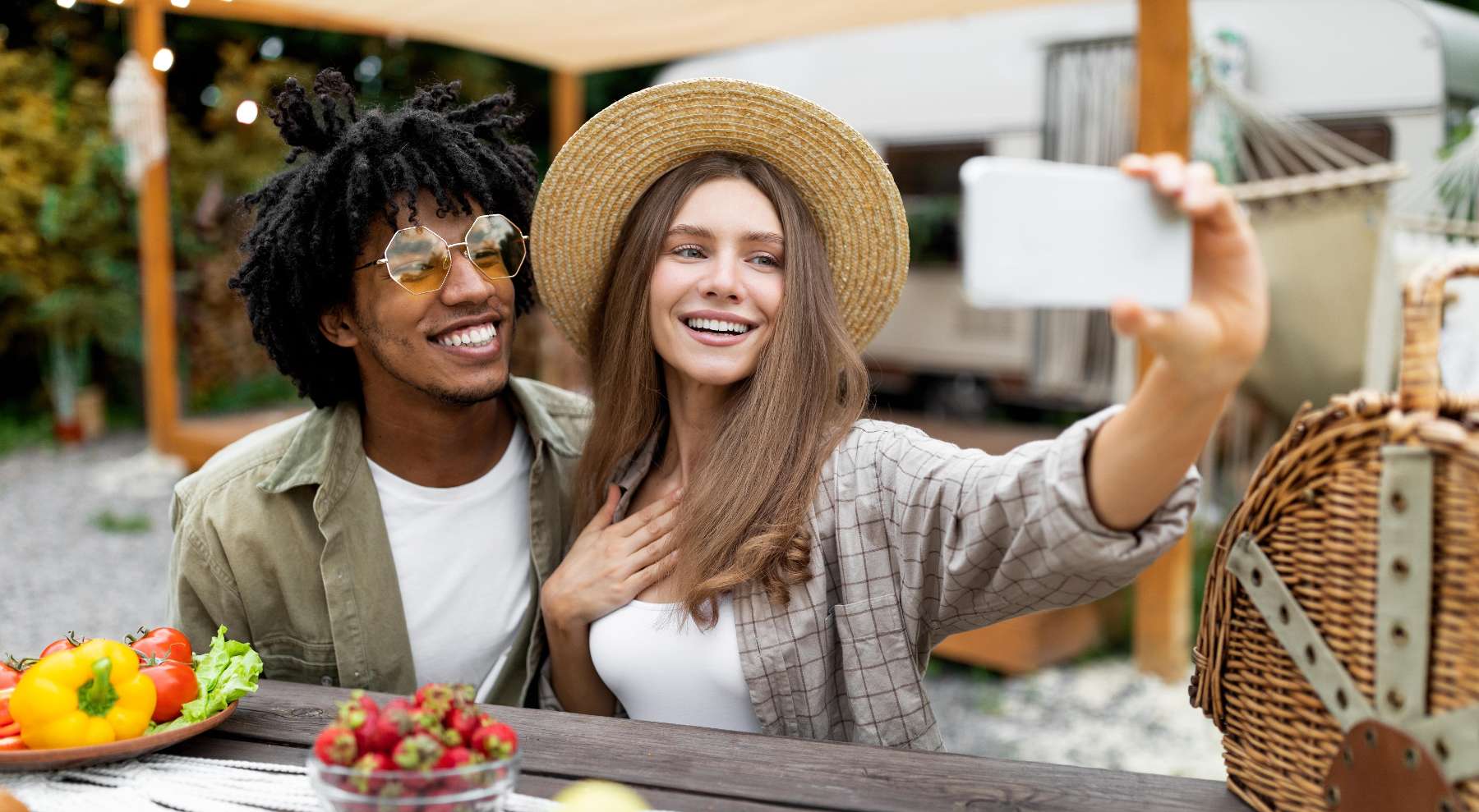 Friends taking selfie together at picnic table, austin tx