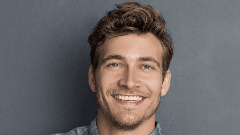 Man smiling after cosmetic dentist appointment, south austin tx