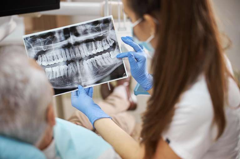 Patient looking at dental x-rays, south austin tx