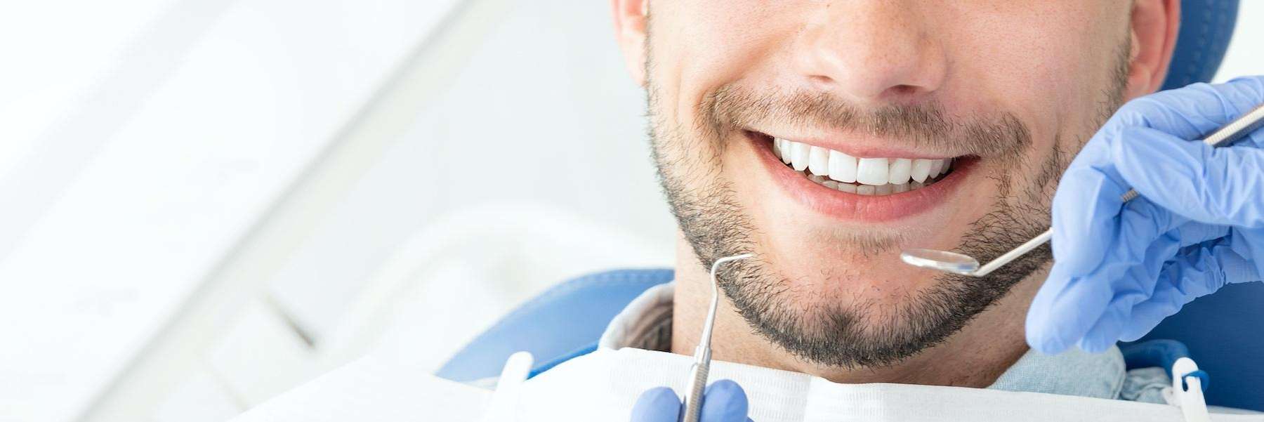 Dental tools about to clean a mans mouth, south austin tx