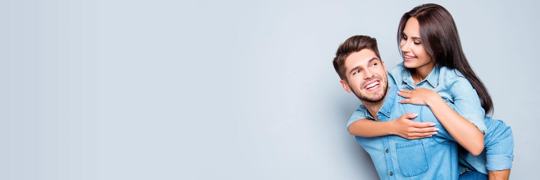 young couple hugging l teeth whitening austin tx